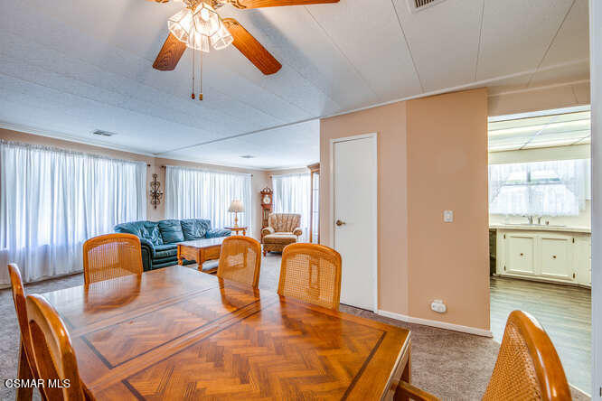 6480 Katherine Road, Unit 121 Simi Valley, CA 93063 - Photo 12 of 34 a view of a dining room with furniture and a window