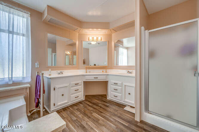 6480 Katherine Road, Unit 121 Simi Valley, CA 93063 - Photo 29 of 34 a spacious bathroom with a double vanity sink mirror and double