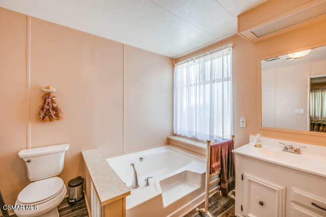 6480 Katherine Road, Unit 121 Simi Valley, CA 93063 - Photo 30 of 34 a bathroom with a sink toilet and window