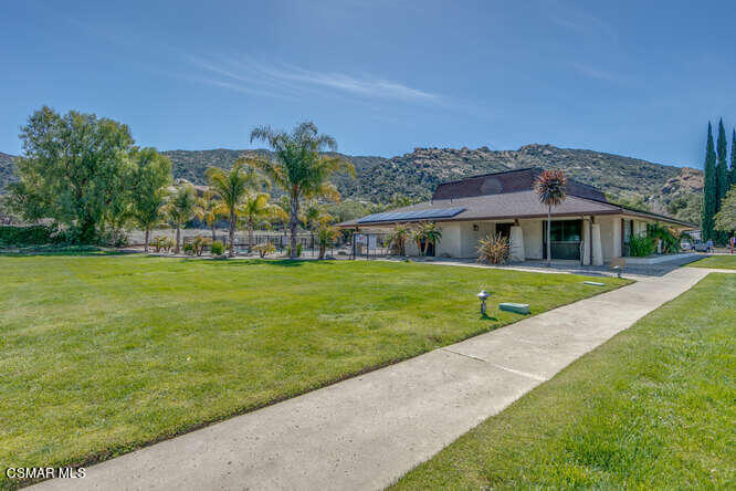 6480 Katherine Road, Unit 121 Simi Valley, CA 93063 - Photo 31 of 34 a view of house with a garden