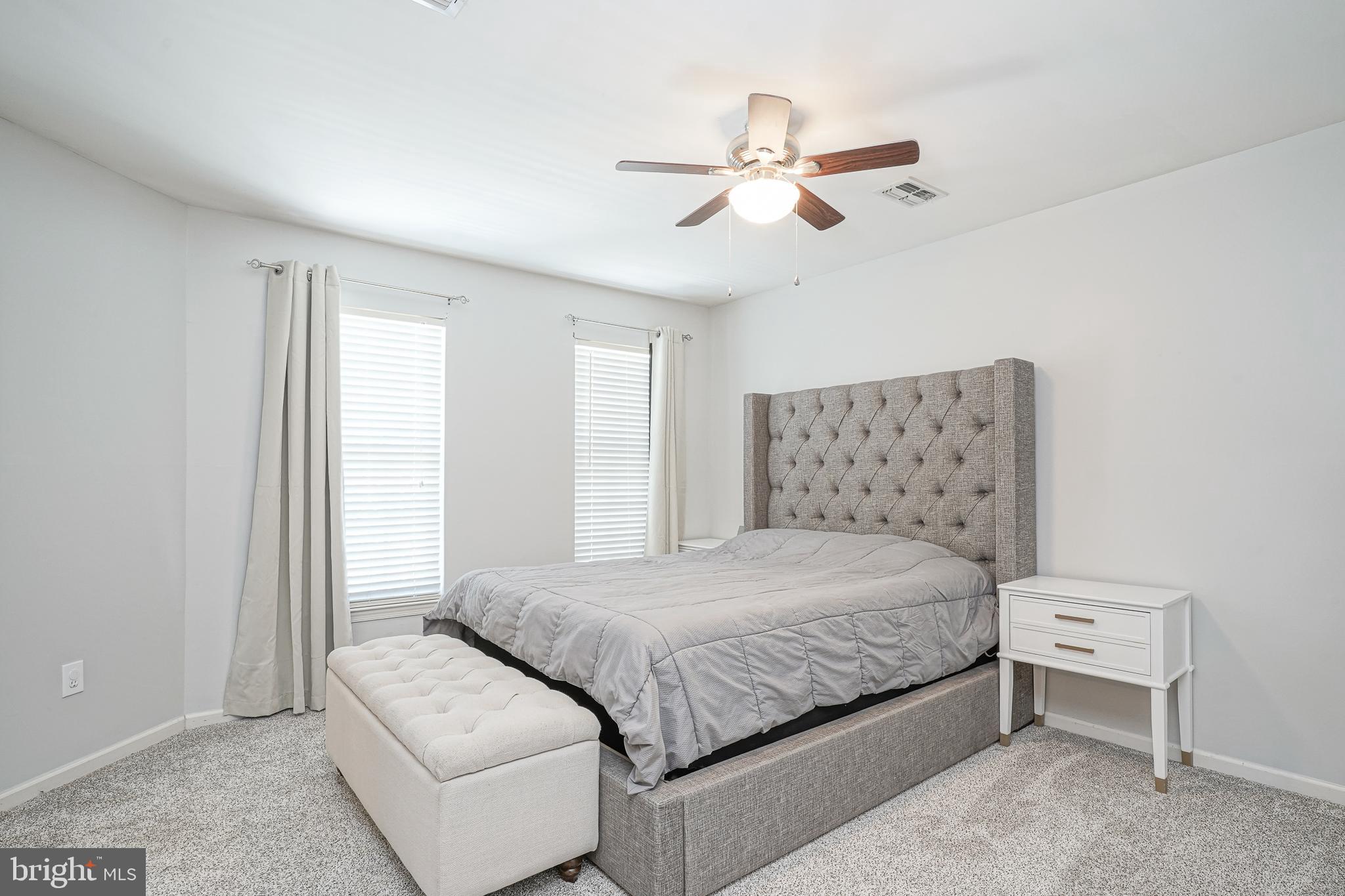 7 Middleton Drive Lumberton, NJ 08048 - Photo 15 of 42 a bedroom with a bed and a chandelier