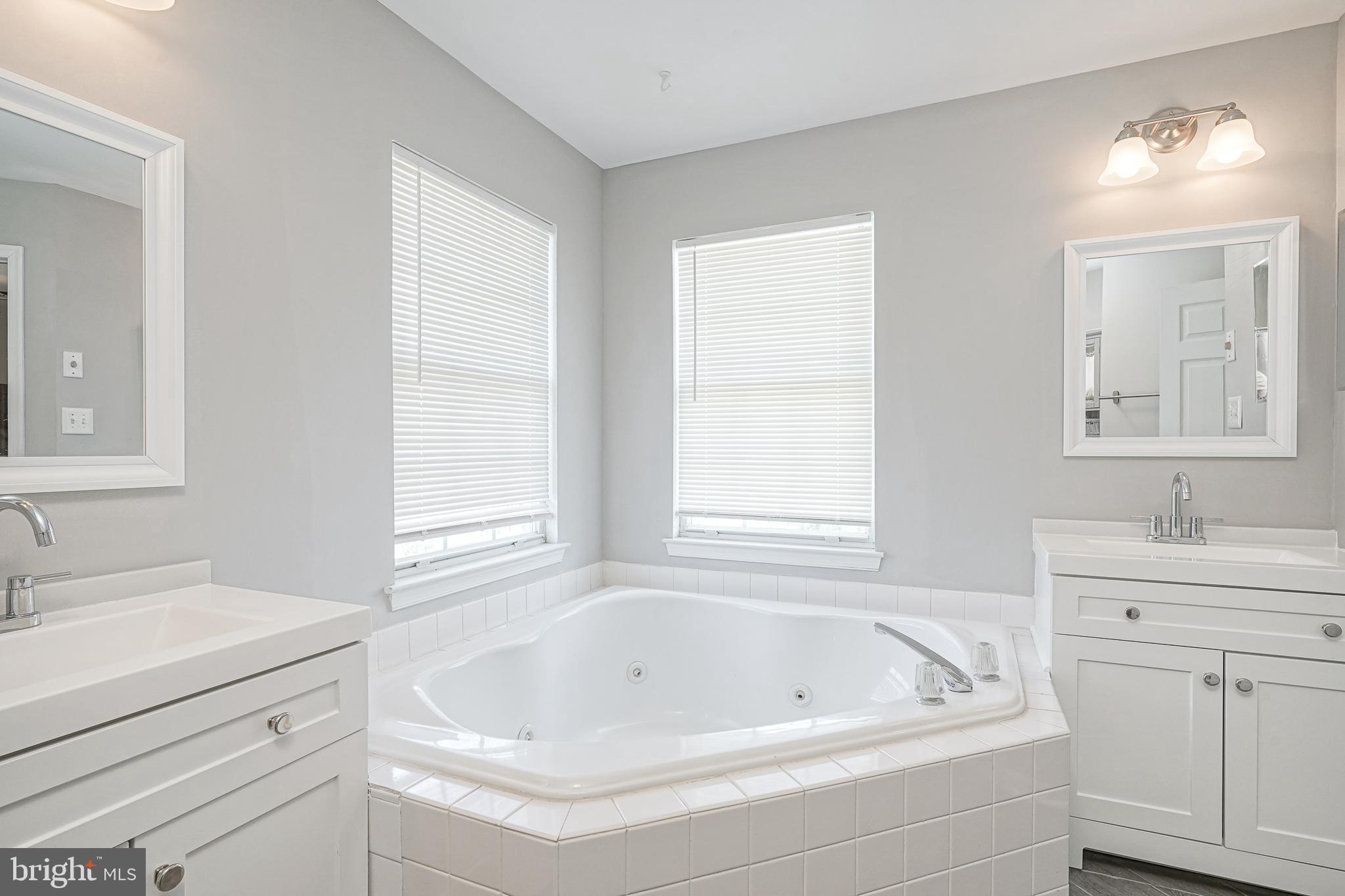 7 Middleton Drive Lumberton, NJ 08048 - Photo 18 of 42 a bathroom with a bathtub a sink a vanity and a window