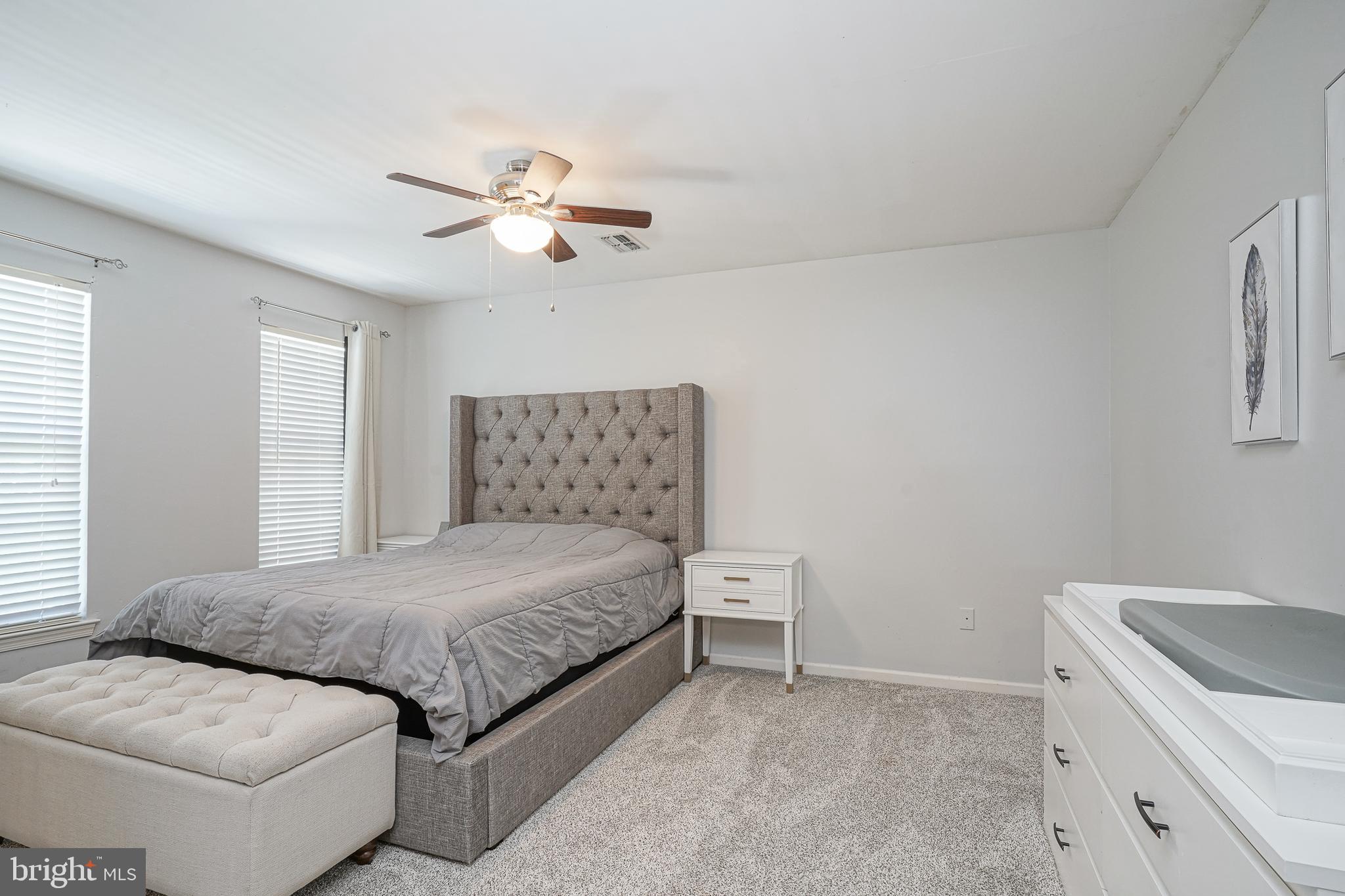 7 Middleton Drive Lumberton, NJ 08048 - Photo 23 of 42 a bedroom with a bed and a chandelier