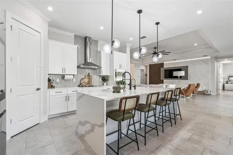 a kitchen with stainless steel appliances white cabinets and a counter top space
