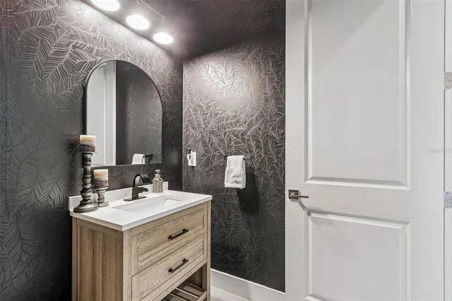 a bedroom with a bed and flat screen tv