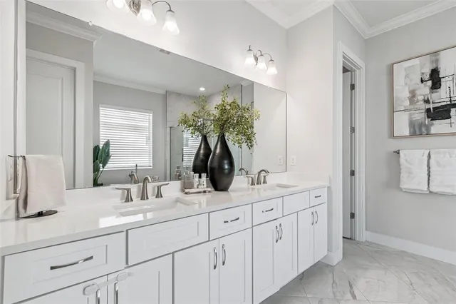 a white bath tub sitting next to a white sink