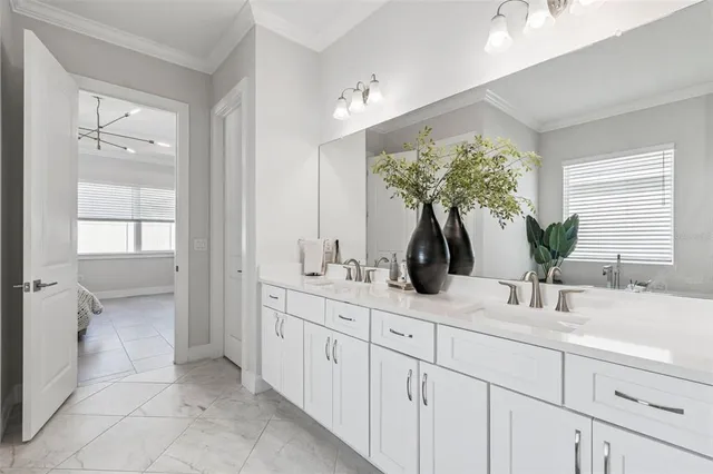 a kitchen with cabinets and chairs