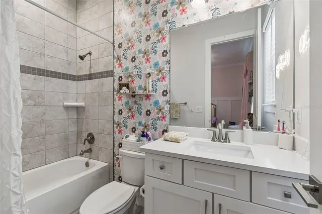 a bathroom with a sink a toilet and bathtub