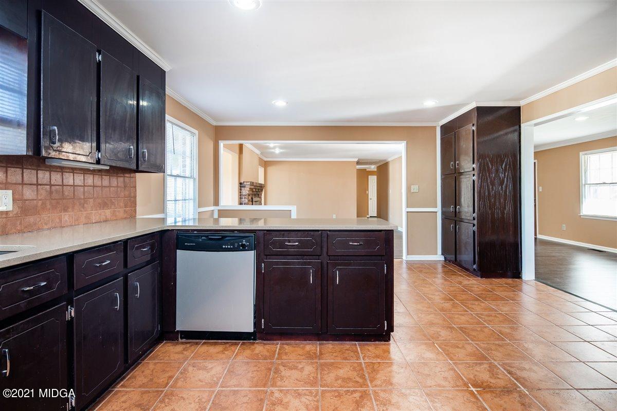 3309 Sandy Circle Macon, GA 31216 - Photo 11 of 35 a kitchen with a refrigerator and a sink