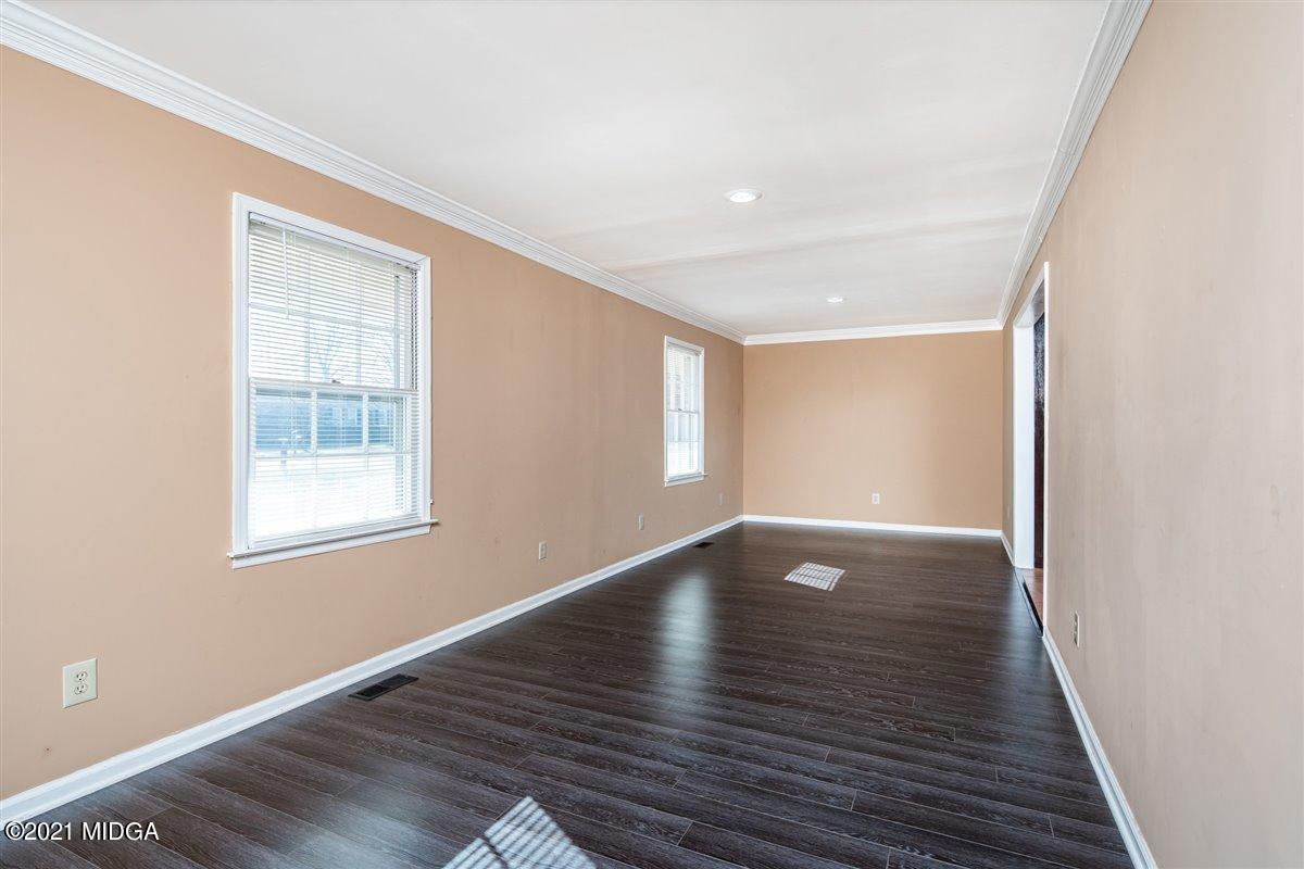 3309 Sandy Circle Macon, GA 31216 - Photo 23 of 35 a view of an empty room with wooden floor and a window