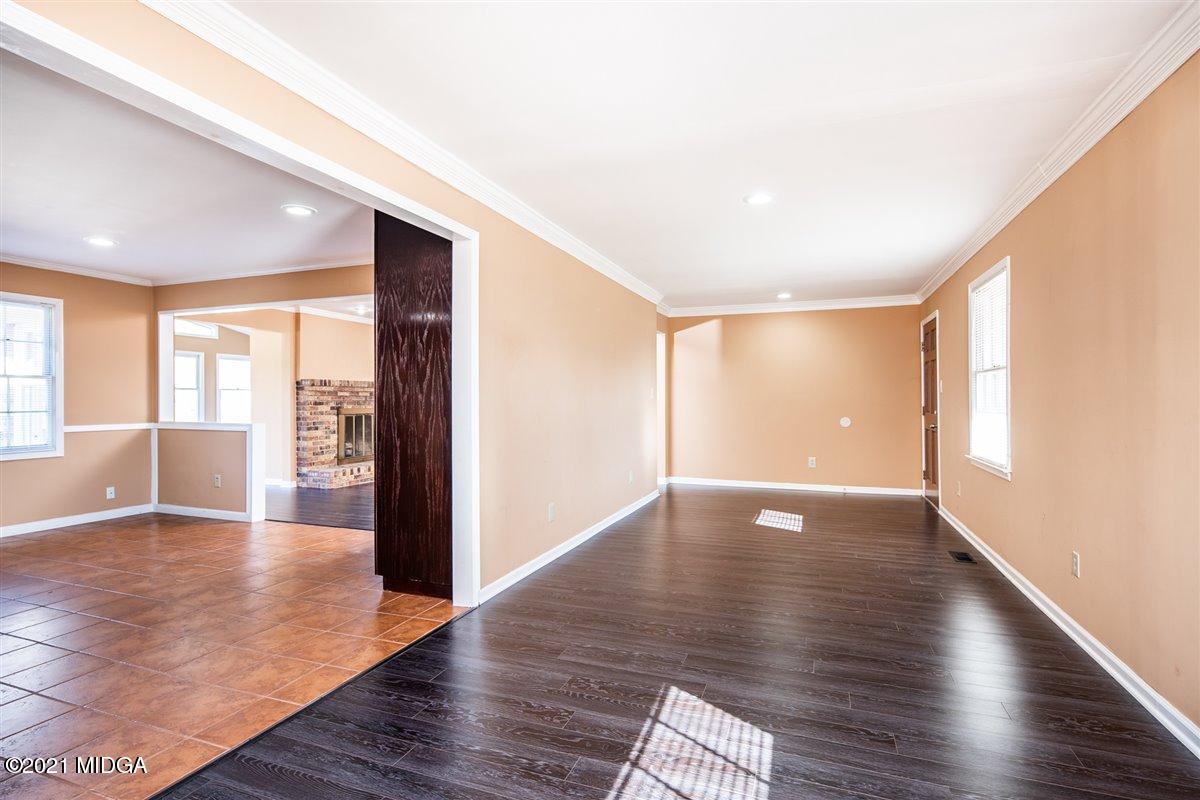 3309 Sandy Circle Macon, GA 31216 - Photo 25 of 35 a view of an empty room with wooden floor and a window