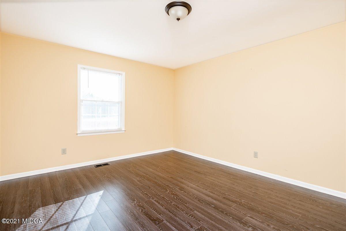 3309 Sandy Circle Macon, GA 31216 - Photo 27 of 35 a view of a room with wooden floor and window