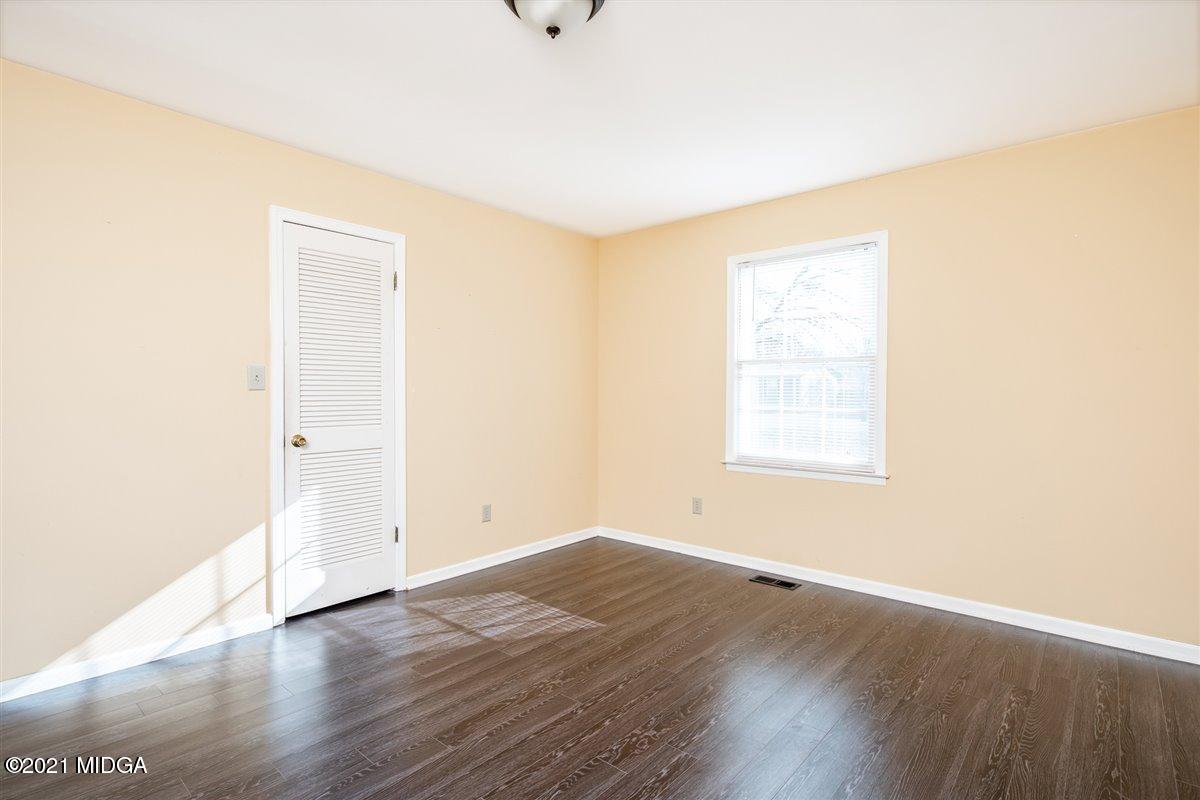 3309 Sandy Circle Macon, GA 31216 - Photo 28 of 35 an empty room with wooden floor and windows