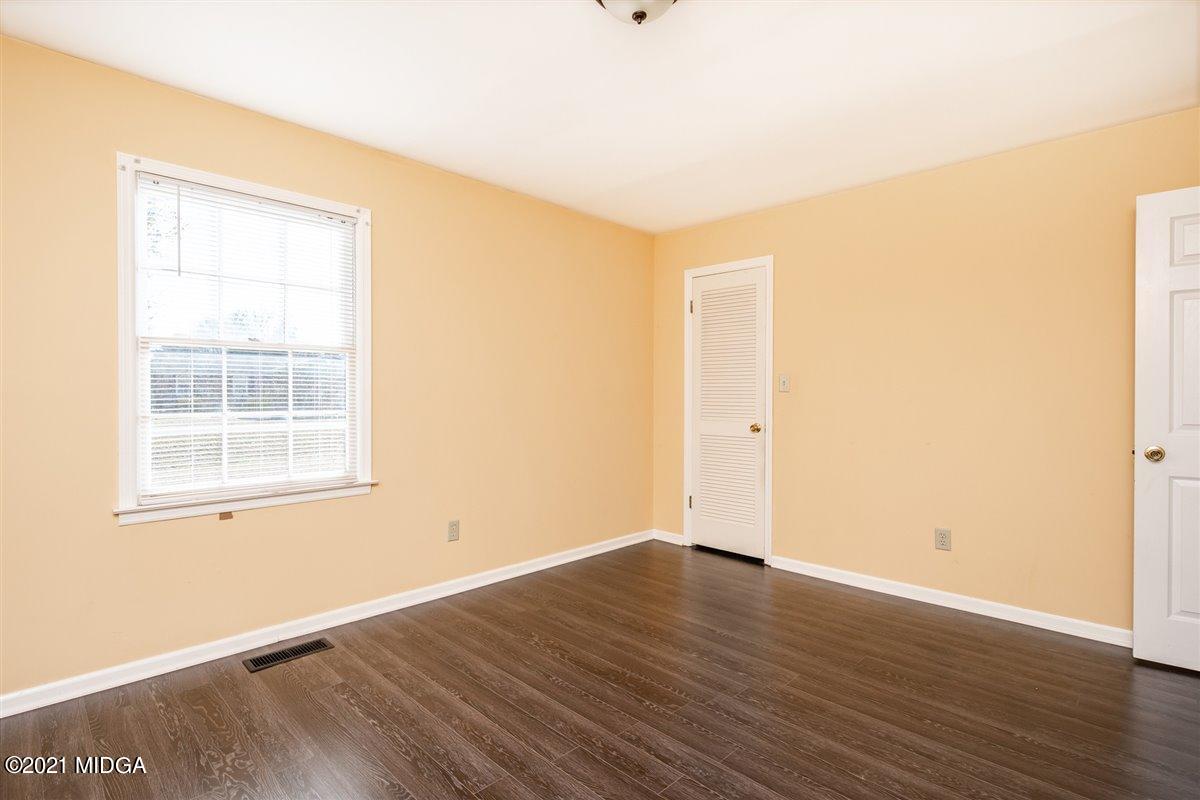 3309 Sandy Circle Macon, GA 31216 - Photo 30 of 35 an empty room with wooden floor and windows