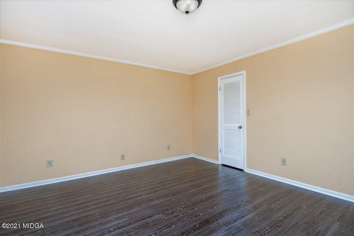 3309 Sandy Circle Macon, GA 31216 - Photo 32 of 35 a view of an empty room with wooden floor