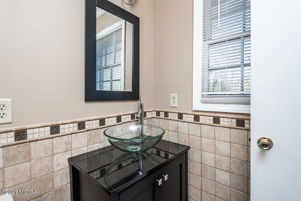 3309 Sandy Circle Macon, GA 31216 - Photo 34 of 35 a bathroom with a sink and a window