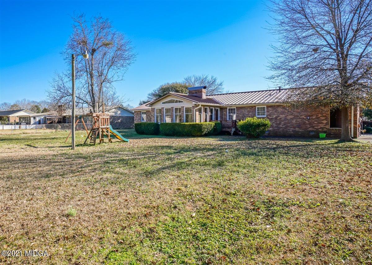3309 Sandy Circle Macon, GA 31216 - Photo 7 of 35 a view of a house with a yard