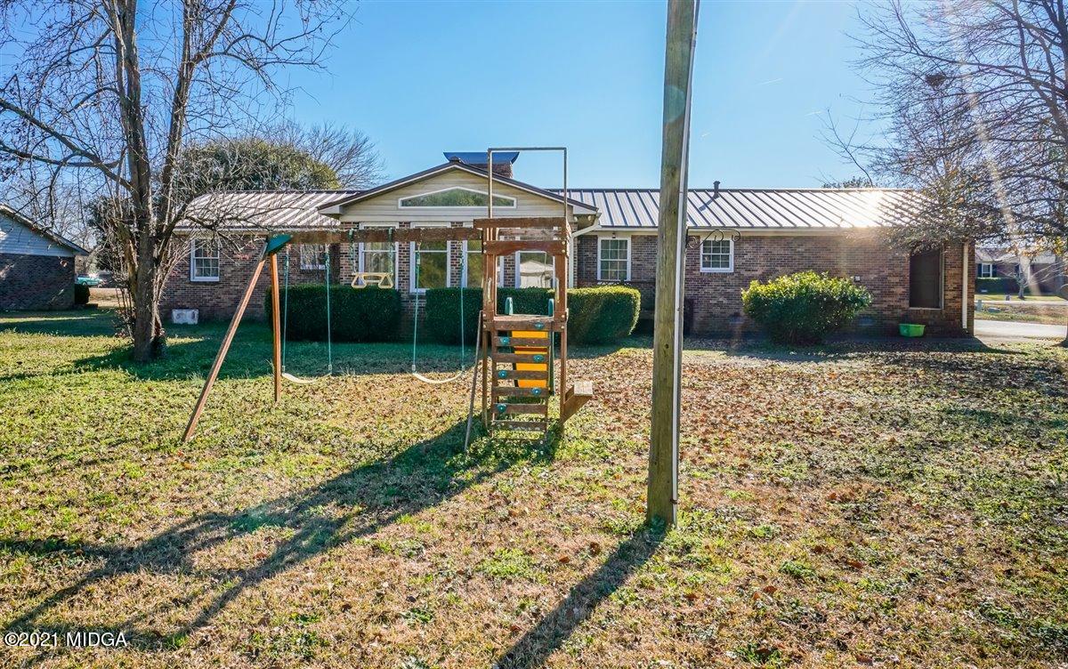3309 Sandy Circle Macon, GA 31216 - Photo 8 of 35 a view of a house with a yard