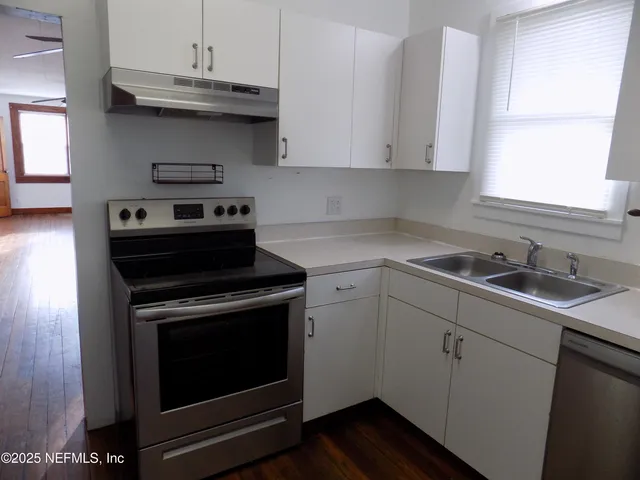 a view of entryway with wooden door