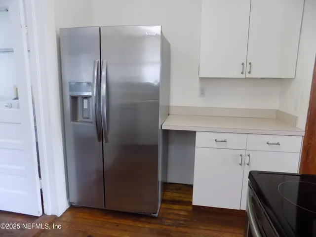 a view of balcony with wooden floor