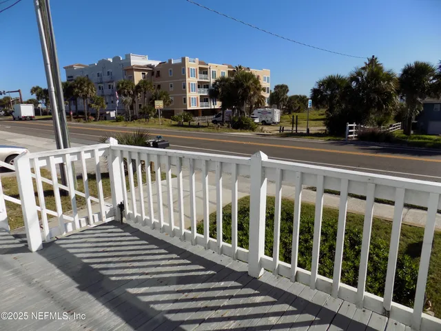 a view of car parked on the roadside