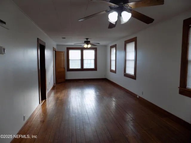 a bathroom with a toilet a sink and a window