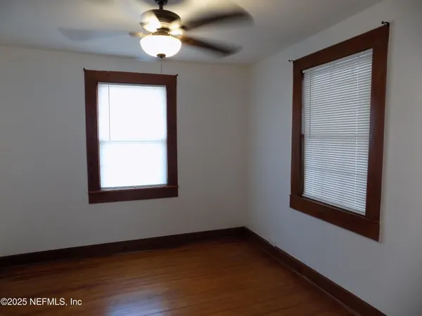 a kitchen with stainless steel appliances granite countertop white cabinets and a stove a sink