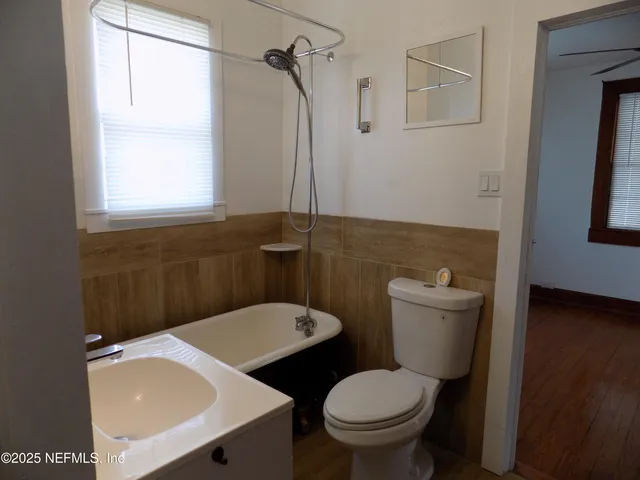 a room with a sink cabinets and a window