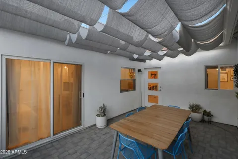 a view of a swimming pool with a patio