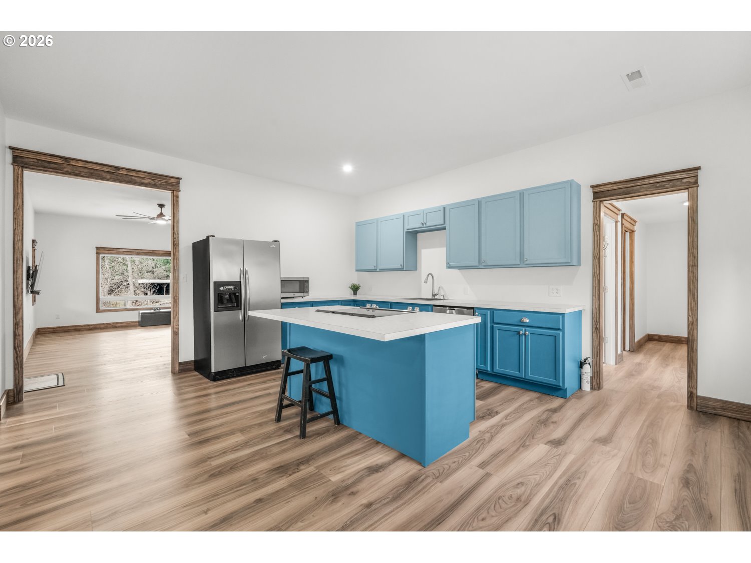 932 Zelinski Road Goldendale, WA 98620 - Photo 17 of 40 a kitchen with stainless steel appliances kitchen island granite countertop a refrigerator a sink dishwasher and a stove with wooden floor