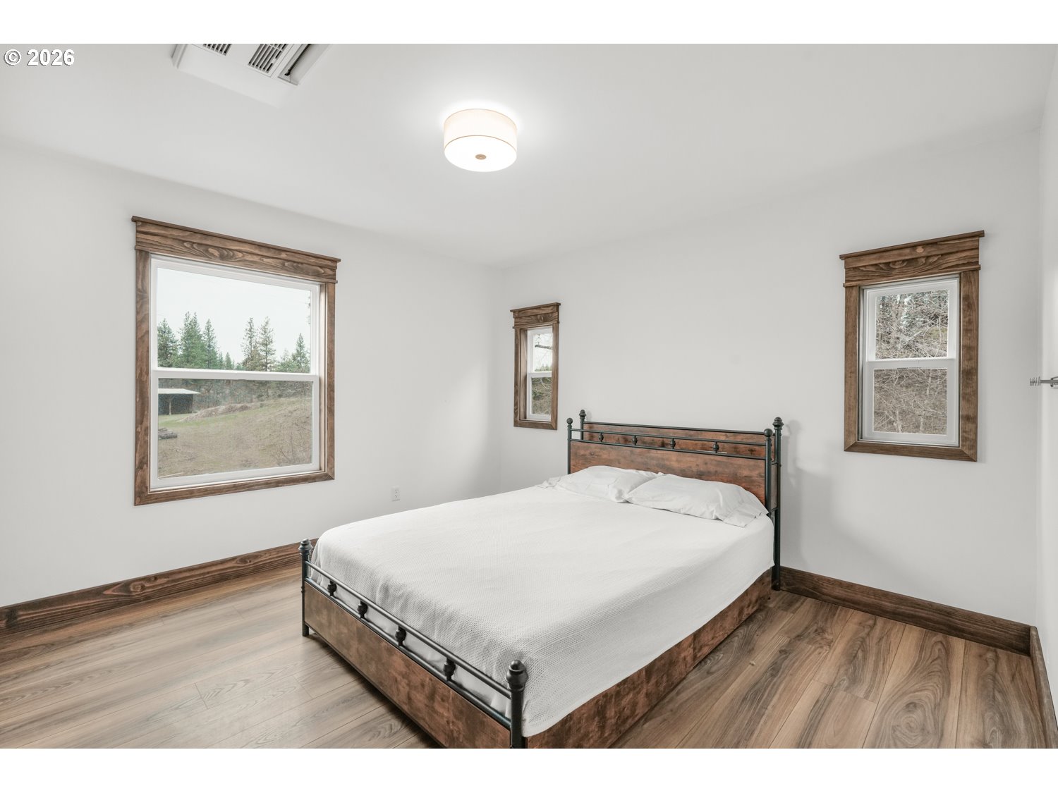 932 Zelinski Road Goldendale, WA 98620 - Photo 20 of 40 a bedroom with a bed and a night stand