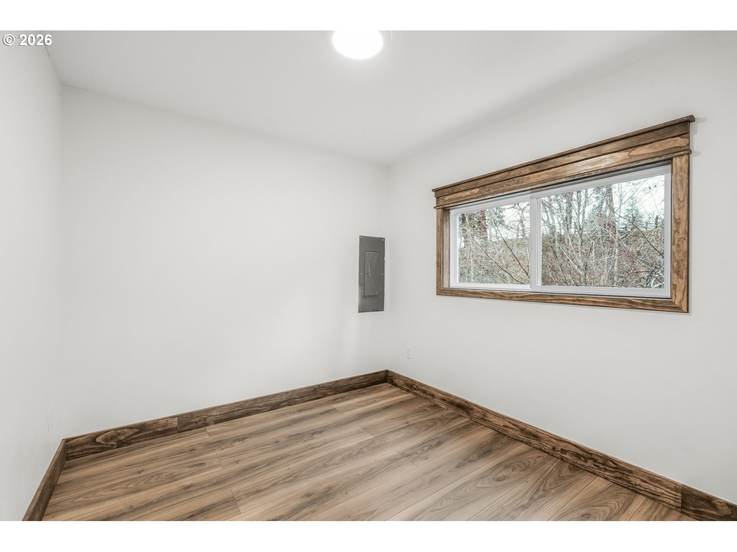 932 Zelinski Road Goldendale, WA 98620 - Photo 22 of 40 an empty room with wooden floor and windows