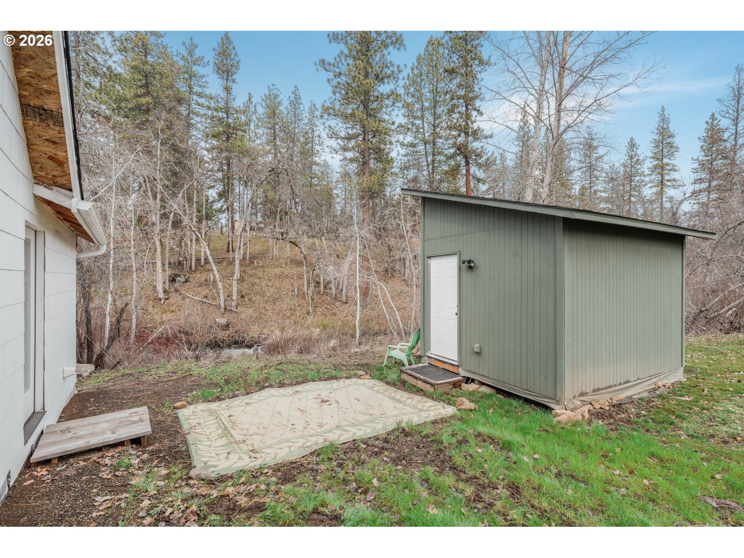 932 Zelinski Road Goldendale, WA 98620 - Photo 28 of 40 a backyard of a house with a yard and garage