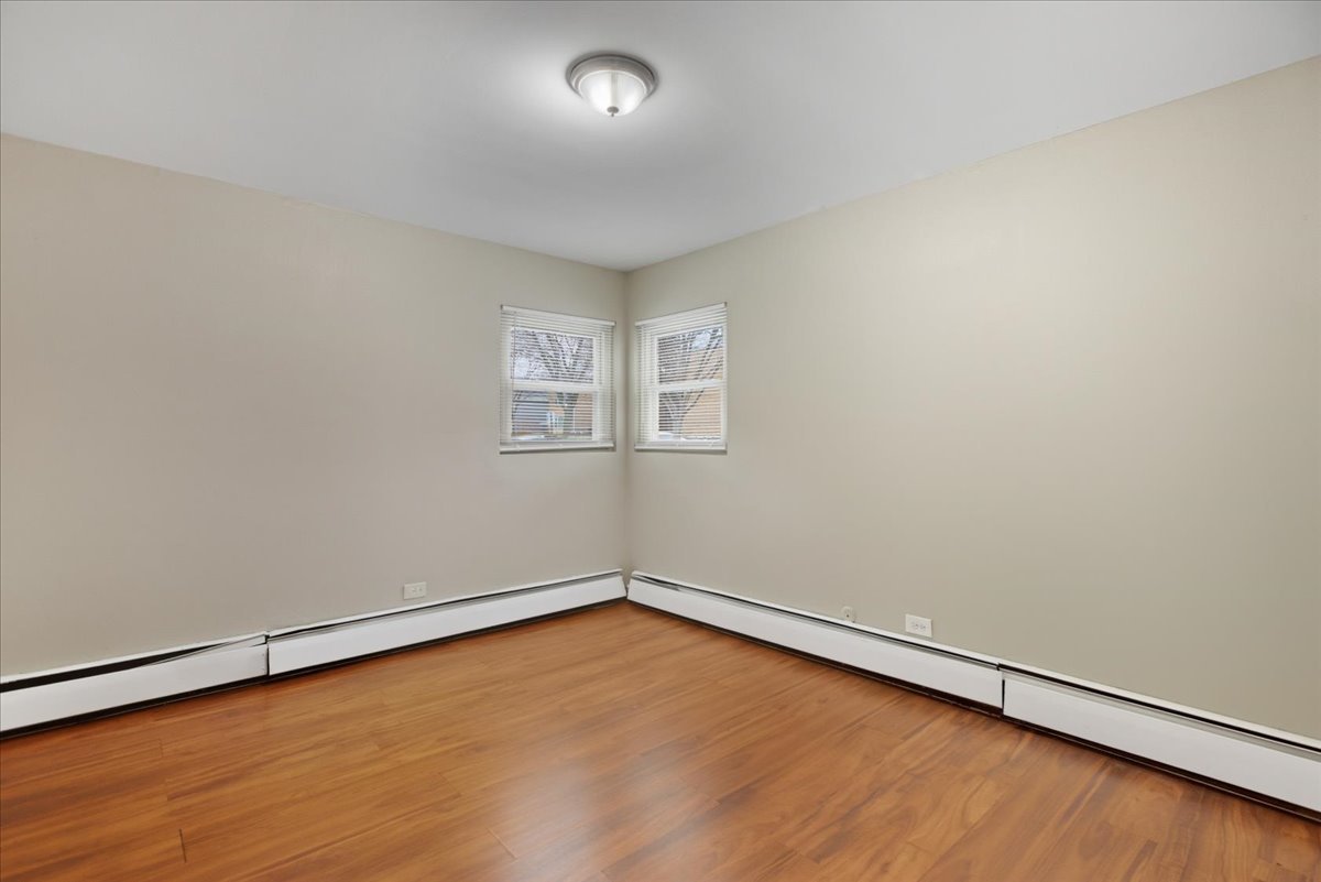 337 Custer Avenue, Unit G Evanston, IL 60202 - Photo 7 of 11 an empty room with a workbench
