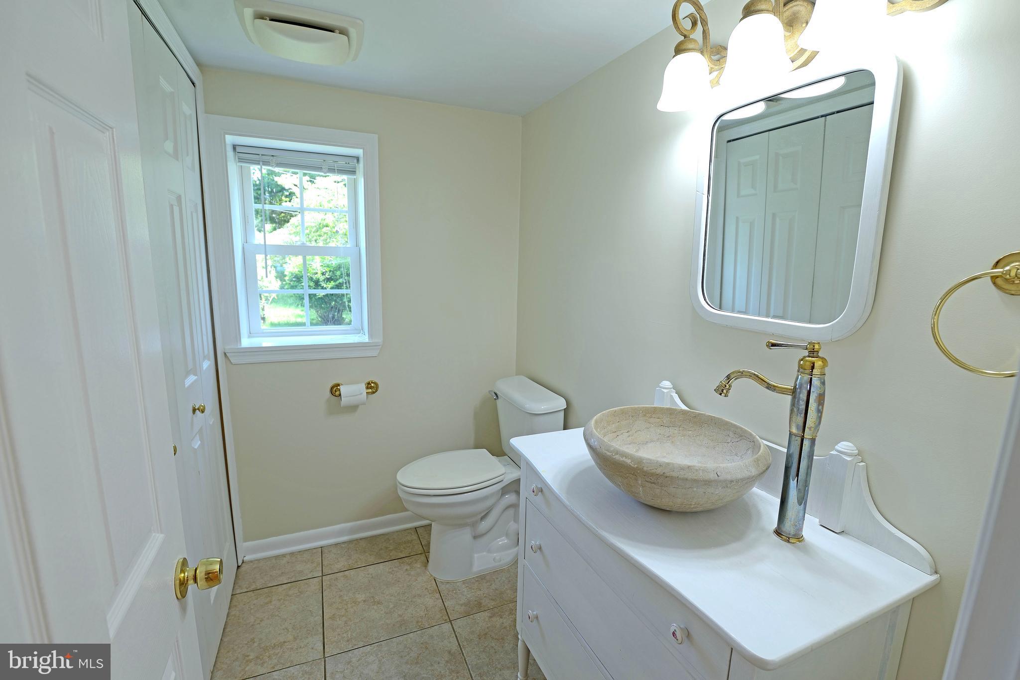 1883 Poplar Ridge Road Pasadena, MD 21122 - Photo 13 of 36 half bath off kitchen with laundry
