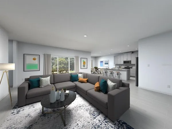 a living room with furniture and a large window