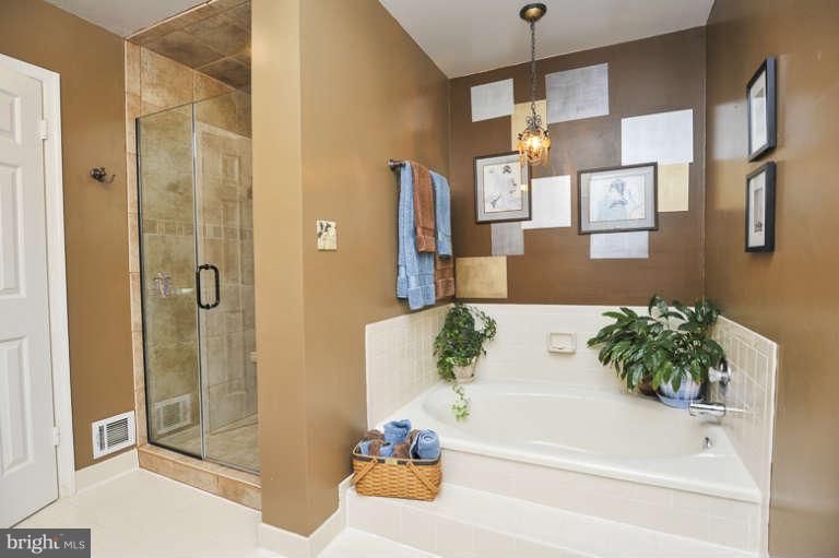 7723 Huntsman Boulevard Springfield, VA 22153 - Photo 15 of 29 Master bath with separate shower and soaking tub