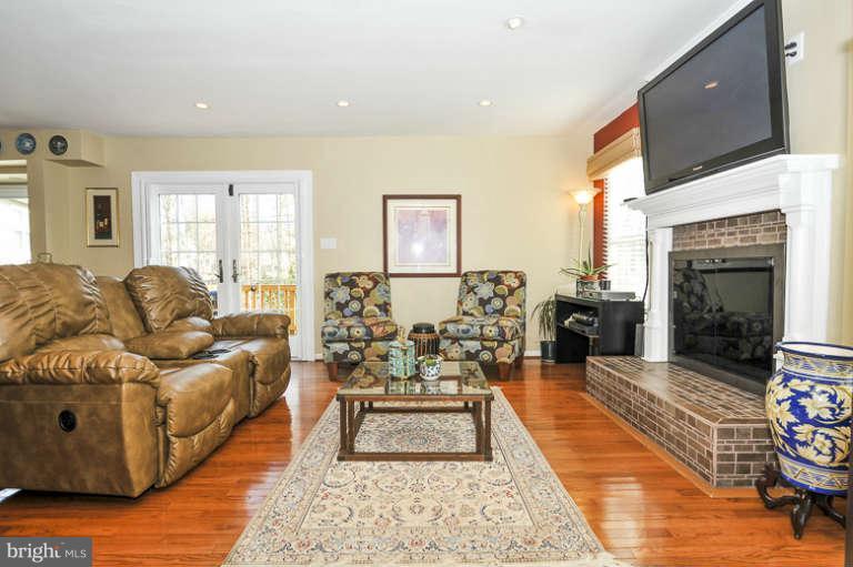 7723 Huntsman Boulevard Springfield, VA 22153 - Photo 3 of 29 Glass French doors lead out to deck