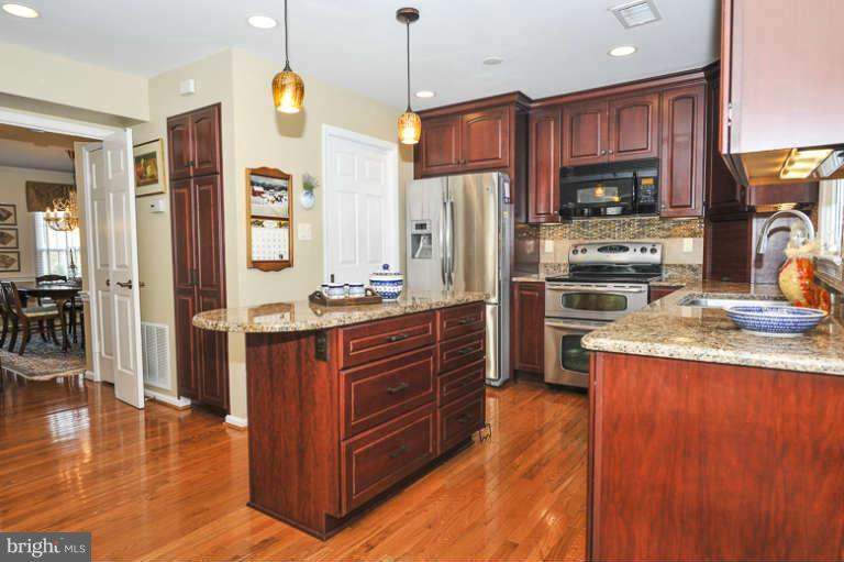 7723 Huntsman Boulevard Springfield, VA 22153 - Photo 10 of 29 Center Island & Stainless Appliances