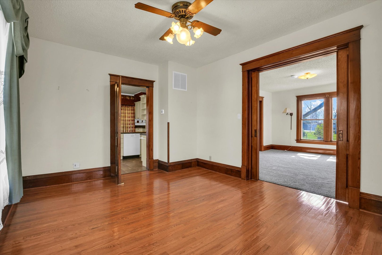 430 Indiana Avenue De Land, IL 61839 - Photo 15 of 48 a view of an empty room with window and wooden floor