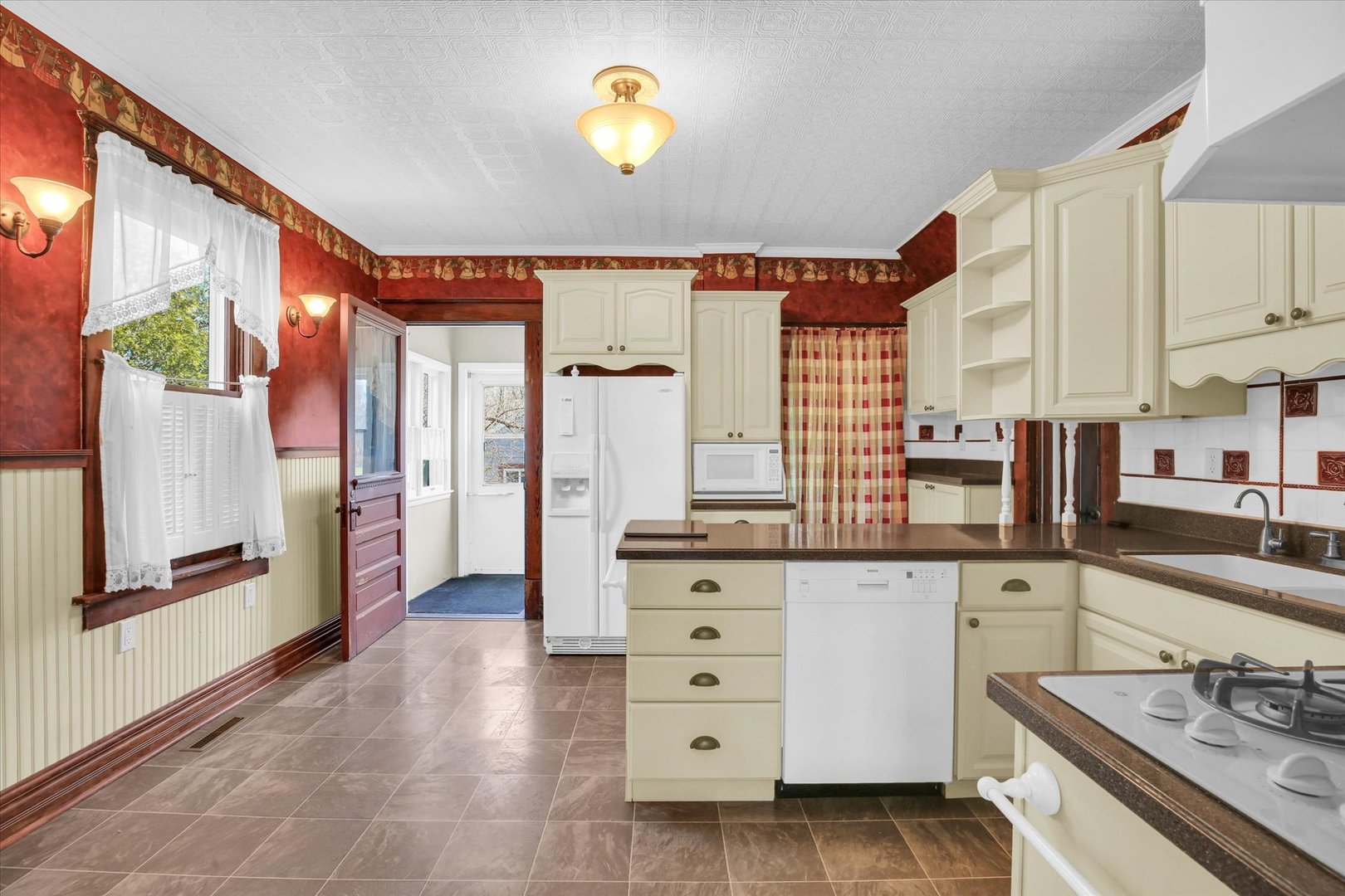 430 Indiana Avenue De Land, IL 61839 - Photo 17 of 48 a kitchen with stainless steel appliances a stove a sink and a refrigerator