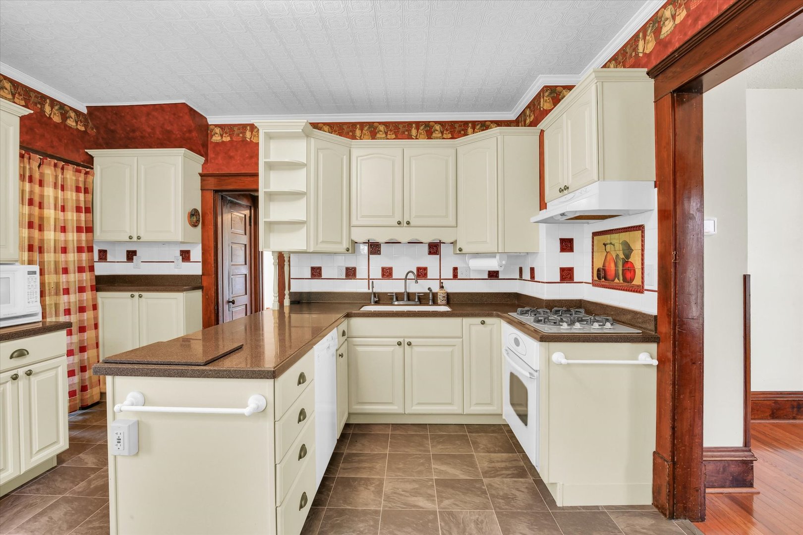 430 Indiana Avenue De Land, IL 61839 - Photo 19 of 48 a kitchen with stainless steel appliances granite countertop a stove a sink and a refrigerator