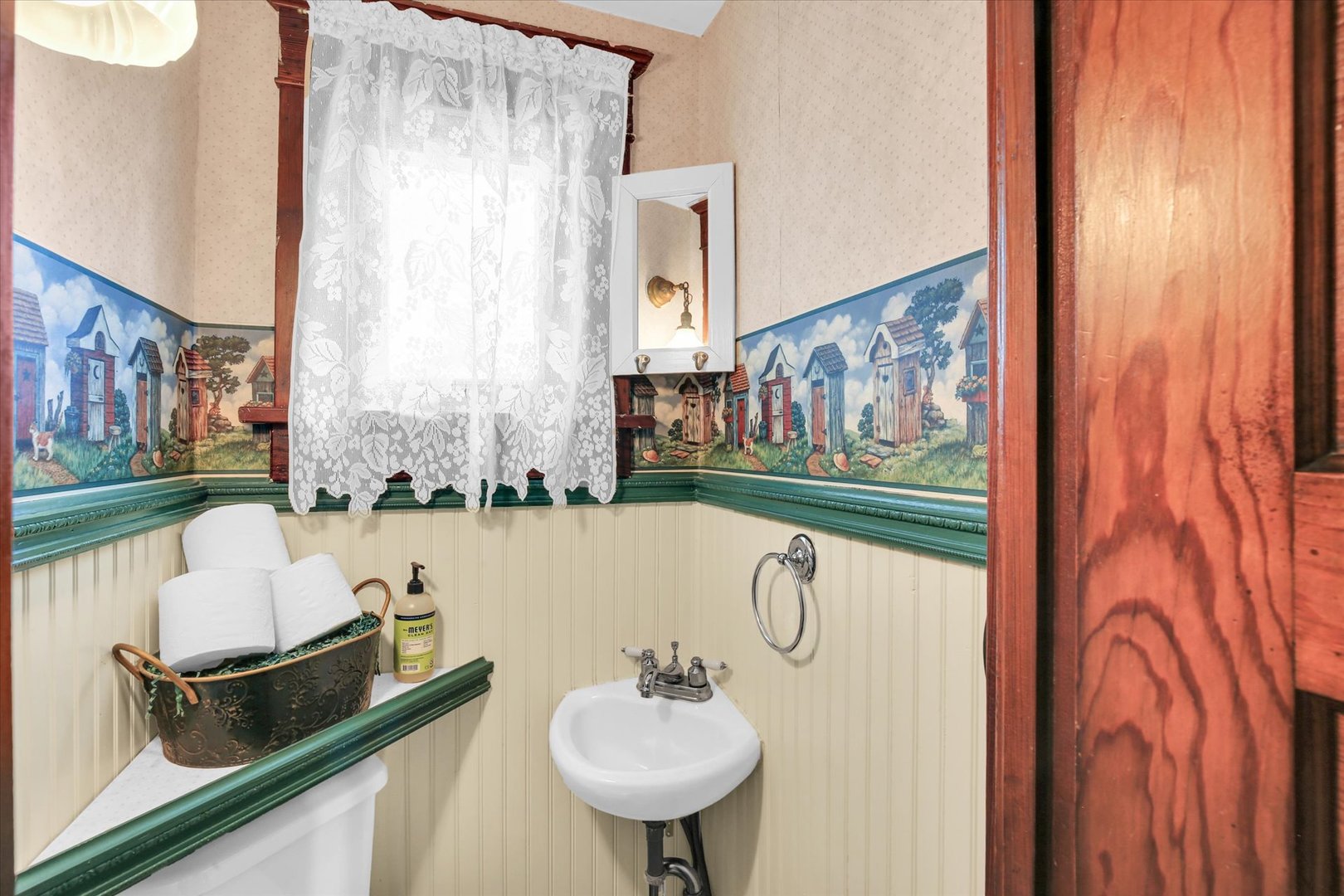 430 Indiana Avenue De Land, IL 61839 - Photo 21 of 48 a bathroom with a sink and a mirror