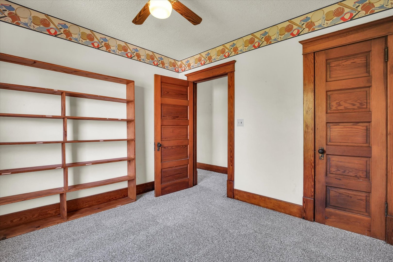 430 Indiana Avenue De Land, IL 61839 - Photo 25 of 48 a view of an empty room with cabinet and a window