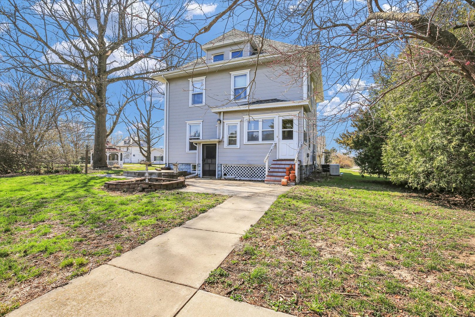 430 Indiana Avenue De Land, IL 61839 - Photo 35 of 48 a view of a house with backyard and a tree