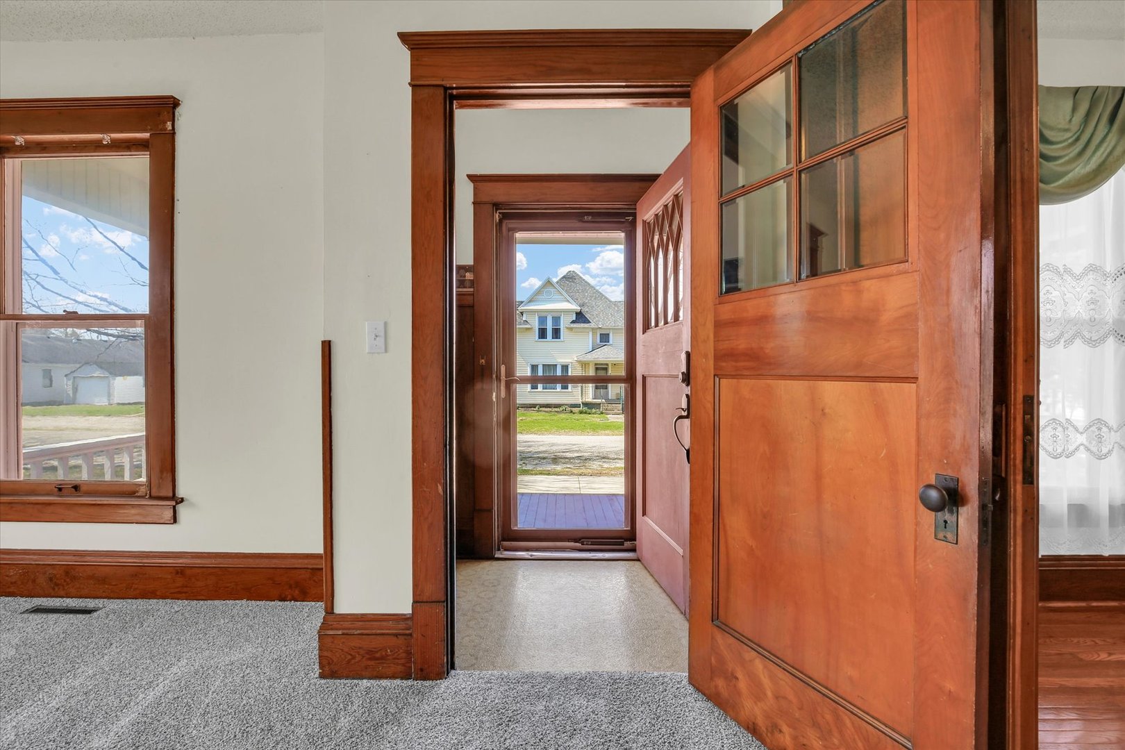 430 Indiana Avenue De Land, IL 61839 - Photo 8 of 48 a view of a hallway with wooden floor and a living room