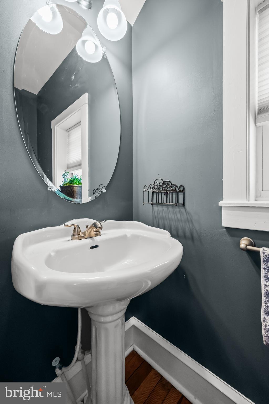 615 North Walnut Avenue Magnolia, NJ 08049 - Photo 17 of 40 a bathroom with a sink and a mirror