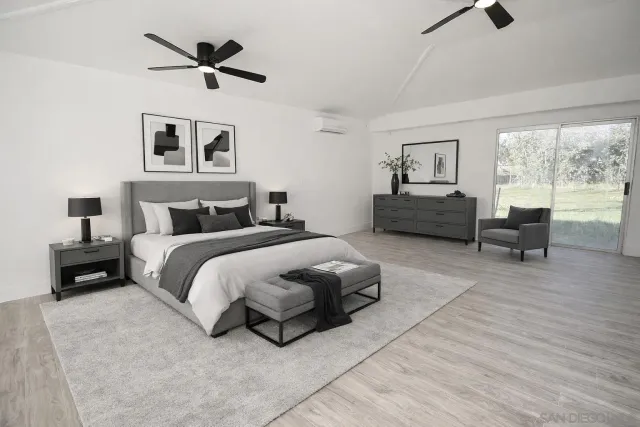 a bedroom with a bed and a couch