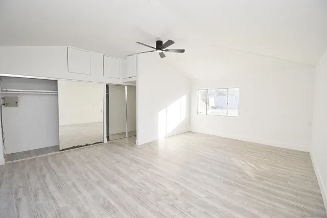 a bedroom with a bed and night stand