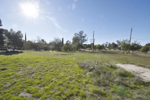 a swimming pool with outdoor seating and yard